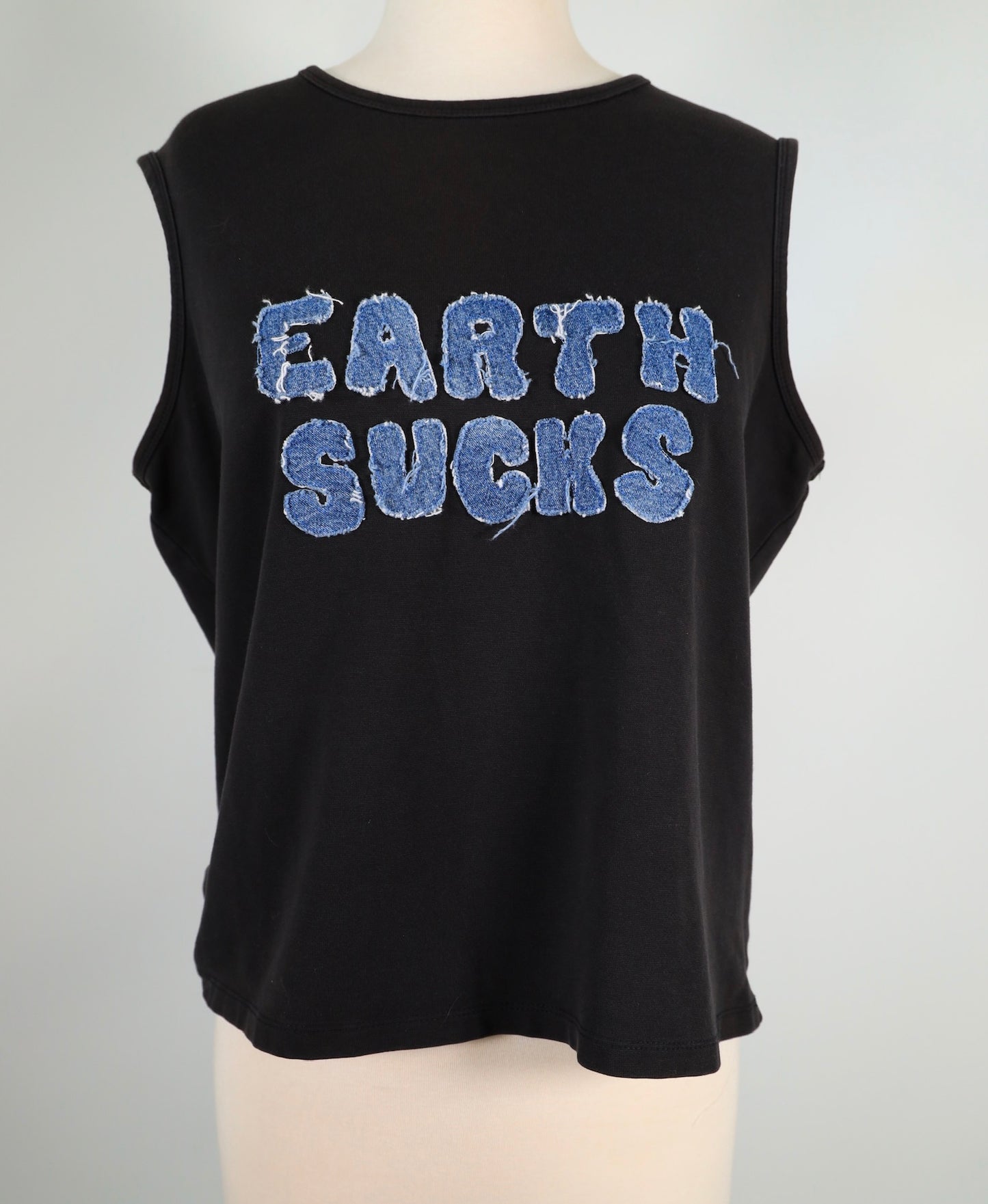 EARTH SUCKS Top